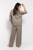 Women's linen loungewear set in taupe, featuring a relaxed-fit button-up top with rolled sleeves and wide-leg pants with a rope belt. Perfect for casual wear, travel, or summer days with breathable comfort.