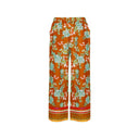 Orange Floral print wide-leg pants for women with an elastic waistband and decorative border hem. Lightweight and breezy, perfect for boho-chic looks, summer outfits, and vacation wear.