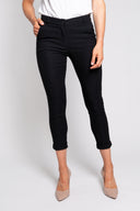 Black slim-fit pants for women with a cropped length, button closure, and rolled cuffs. Stylish and versatile, perfect for casual, office, or smart-casual outfits.