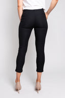 Black slim-fit pants for women with a cropped length, button closure, and rolled cuffs. Stylish and versatile, perfect for casual, office, or smart-casual outfits.