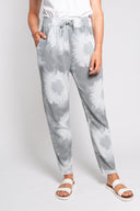 Gray tie-dye joggers for women with a drawstring waist and frayed hem. Soft and comfortable, perfect for casual wear, lounging, or athleisure outfits.