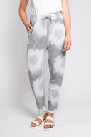 Gray tie-dye joggers for women with a drawstring waist and frayed hem. Soft and comfortable, perfect for casual wear, lounging, or athleisure outfits.