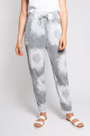 Gray tie-dye joggers for women with a drawstring waist and frayed hem. Soft and comfortable, perfect for casual wear, lounging, or athleisure outfits.