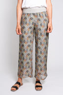 Boho print wide-leg pants for women with a smocked elastic waistband. Lightweight and flowy, perfect for casual wear, beach days, or vacation outfits.