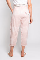 pink tie-dye linen pants for women with a relaxed fit, cropped length, and a decorative belt. Stylish and breathable, perfect for casual wear and boho-inspired outfits.