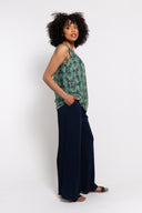 floral sleeveless tank top paired with navy wide-leg pants for a stylish and comfortable outfit. Lightweight and breathable, perfect for casual wear, vacations, or summer looks.