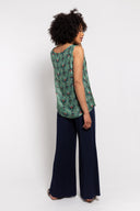 floral sleeveless tank top paired with navy wide-leg pants for a stylish and comfortable outfit. Lightweight and breathable, perfect for casual wear, vacations, or summer looks.