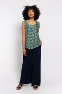 floral sleeveless tank top paired with navy wide-leg pants for a stylish and comfortable outfit. Lightweight and breathable, perfect for casual wear, vacations, or summer looks.