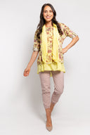 Yellow floral tunic for women with a layered hem, 3/4 sleeves, and a matching lightweight scarf. Perfect for casual wear, spring outfits, and elegant layering.