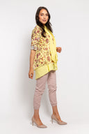 Yellow floral tunic for women with a layered hem, 3/4 sleeves, and a matching lightweight scarf. Perfect for casual wear, spring outfits, and elegant layering.