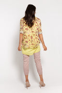 Yellow floral tunic for women with a layered hem, 3/4 sleeves, and a matching lightweight scarf. Perfect for casual wear, spring outfits, and elegant layering.