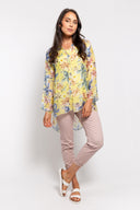 Yellow combo floral chiffon blouse for women with a button-up front, long sleeves, and a flowy high-low hem. Lightweight and elegant, perfect for layering and spring outfits.