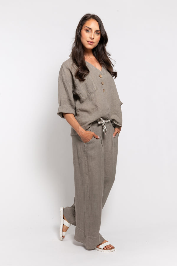 Comfy linen pants set for women in taupe, featuring a loose button-up top with rolled sleeves and wide-leg pants with a stylish rope belt. Perfect for everyday wear, travel, or summer outfits.